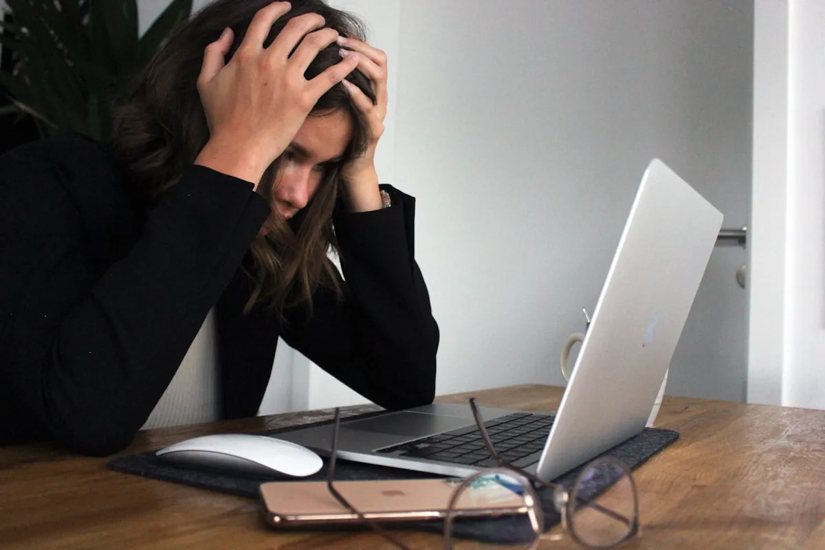 Worried person reviewing bills and financial documents