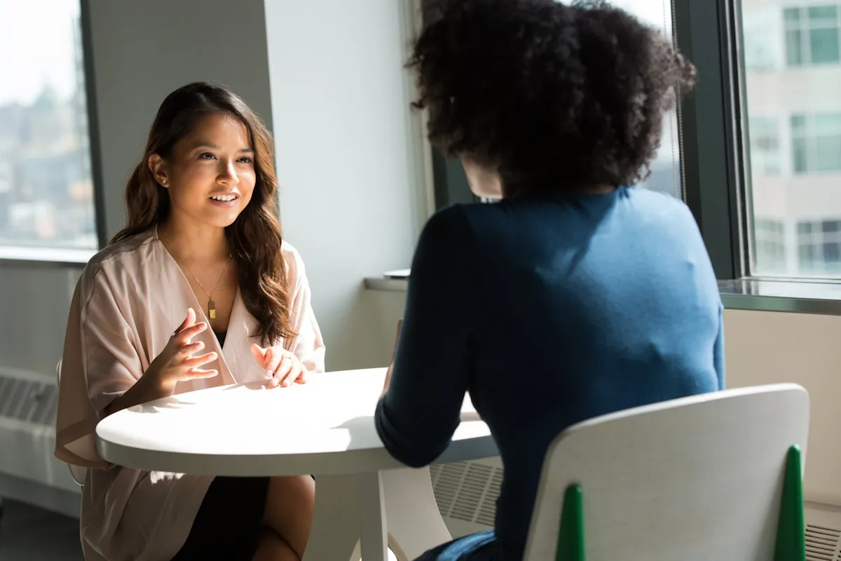 Couple discussing finances in office setting