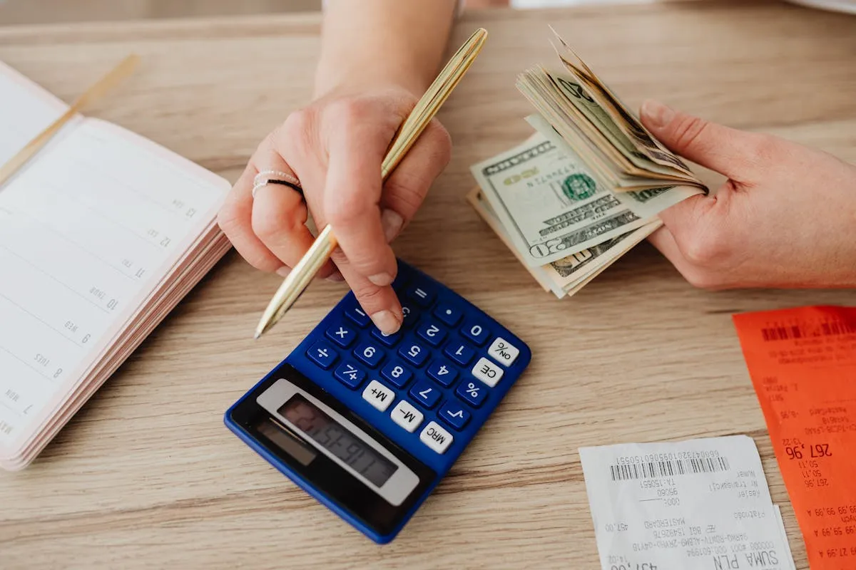 Legal documents and calculator showing probate fee calculations