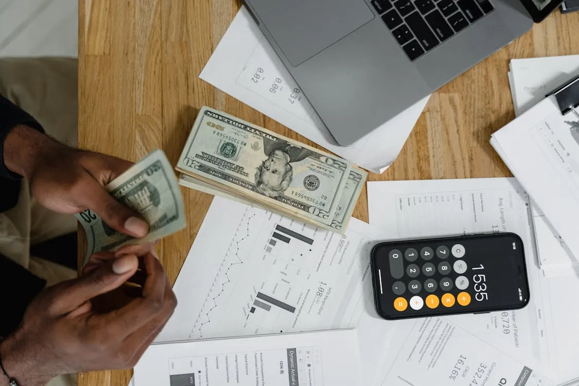Person calculating inheritance money decisions